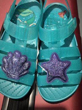 Girls Crocs Teal Glitter Jelly Sandals with Purple Mermaid Charms